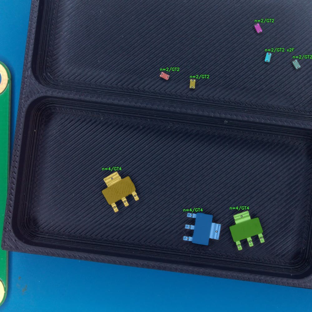 Detection on a tray: each component in its pocket labelled with its nozzle count